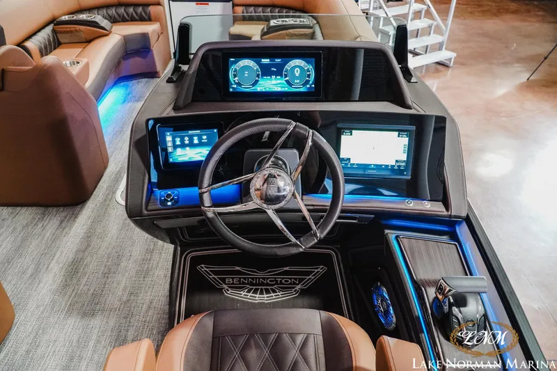 Slide: The Image of 2026 Bennington 25QFBA boat dashboard with modern controls and digital displays. - 13
