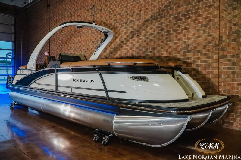 Slide: The Image of 2026 Bennington 25QFBA pontoon boat displayed at Lake Norman Marina. - 3