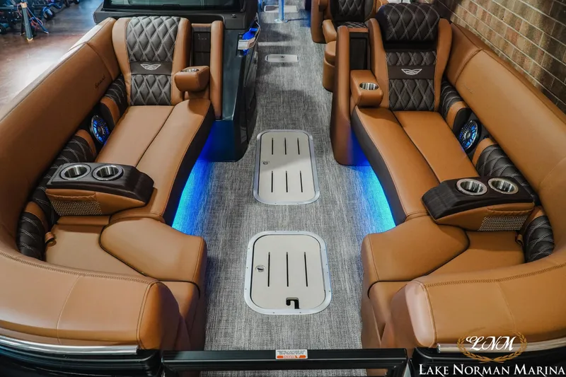 Slide: The Image of Luxurious interior of 2026 Bennington 25QFBA pontoon boat with plush seating and ambient lighting. - 5