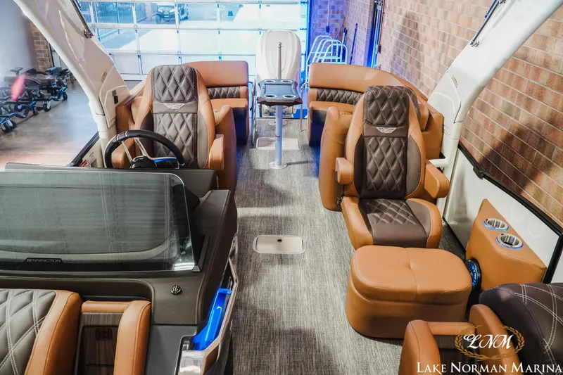 Slide: The Image of Luxurious interior of 2026 Bennington 25QFBA pontoon boat with plush seating. - 7