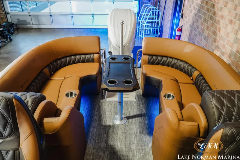 Slide: The Image of Luxurious interior of 2026 Bennington 25QFBA boat with plush seating and table. - 8