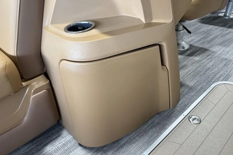 Slide: The Image of Interior of 2026 Godfrey Sweetwater 2286 QS boat, featuring tan seating and cup holder. - 11