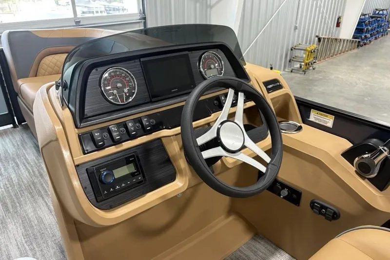 Slide: The Image of Interior view of 2026 Godfrey Sweetwater 2286 QS boat dashboard and steering wheel. - 12