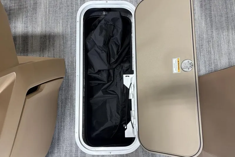 Slide: The Image of Open storage compartment on 2026 Godfrey Sweetwater 2286 QS boat, showing interior details. - 14