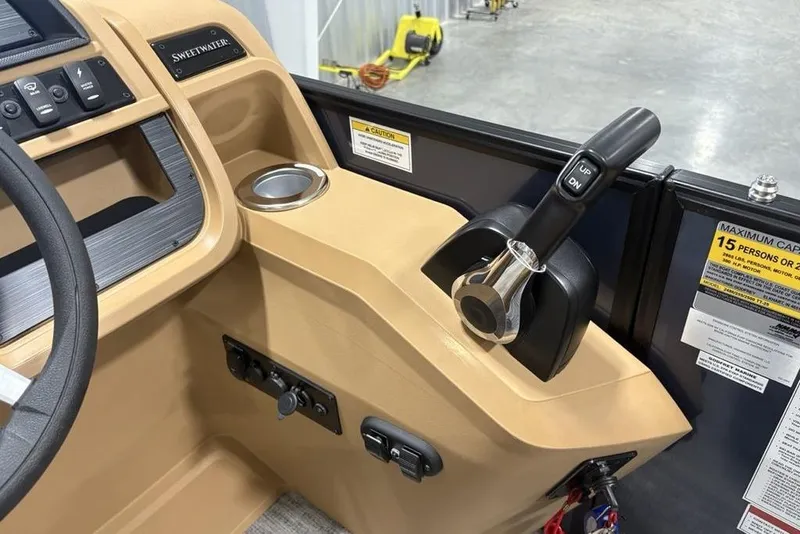 Slide: The Image of 2026 Godfrey Sweetwater 2286 QS boat console with throttle and control panel. - 23