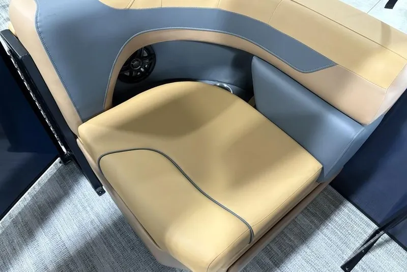 Slide: The Image of Luxurious seating on 2026 Godfrey Sweetwater 2286 QS pontoon boat, featuring tan and gray upholstery. - 24