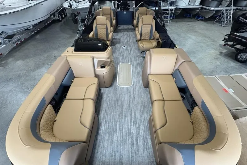 Slide: The Image of 2026 Godfrey Sweetwater 2286 QS pontoon boat interior with luxurious tan seating. - 28