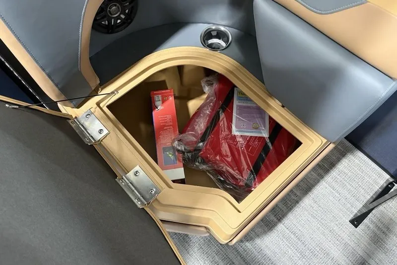Slide: The Image of Storage compartment in 2026 Godfrey Sweetwater 2286 QS boat, containing safety equipment. - 29