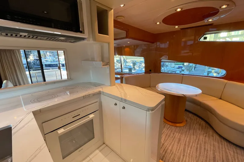 Slide: The Image of Luxurious interior of a 1999 Horizon 70 Motor Yacht with modern kitchen and seating area. - 62
