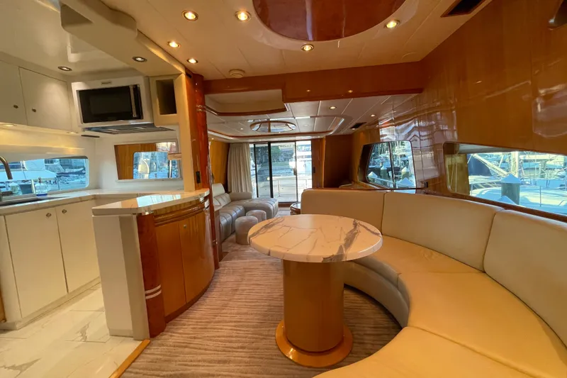Slide: The Image of Luxurious interior of a 1999 Horizon 70 Motor Yacht with elegant seating and modern amenities. - 61