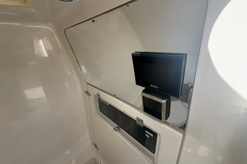 Slide: The Image of Interior of 2018 Jupiter 30 boat with control panel and display screen. - 14