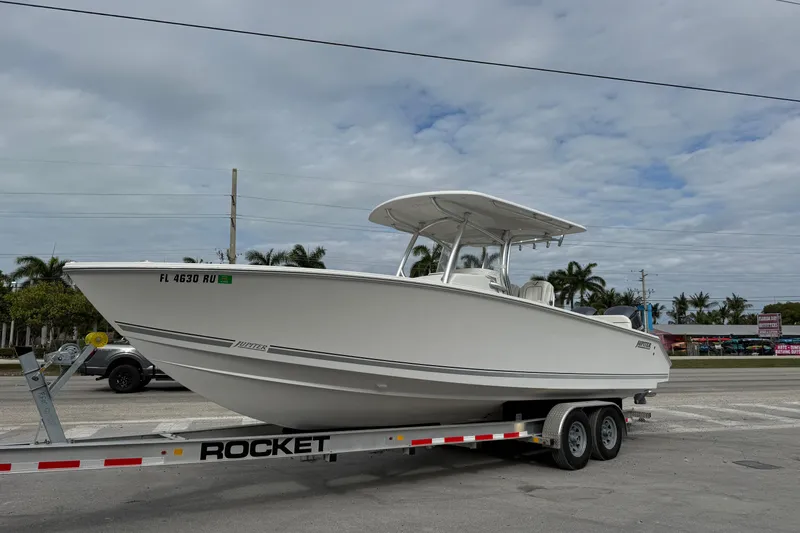 Slide: The Image of 2018 Jupiter 30 boat on calm ocean waters under clear blue sky. - 2