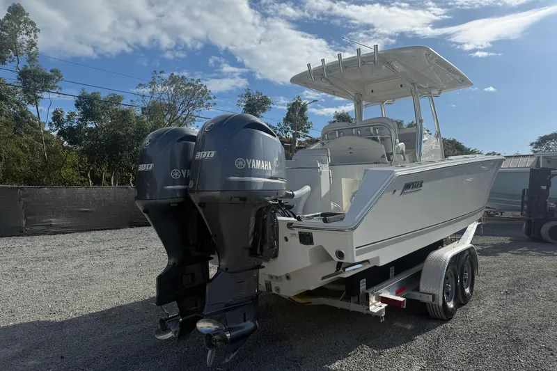 Slide: The Image of 2018 Jupiter 30 boat with dual Yamaha 300 engines on a trailer. - 8