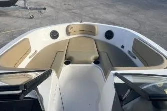 Slide: The Image of 2023 Bayliner VR5 Bowrider OB interior with seating and cup holders. - 10