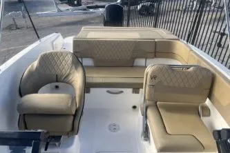 Slide: The Image of 2023 Bayliner VR5 Bowrider OB with beige seating and spacious interior design. - 11