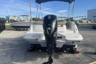 Slide: The Image of 2023 Bayliner VR5 Bowrider OB with outboard motor, parked outdoors. - 6
