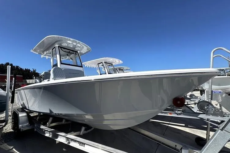 The Image of 2026 Sportsman Masters 227 Bay Boat on trailer under clear blue sky. - 1