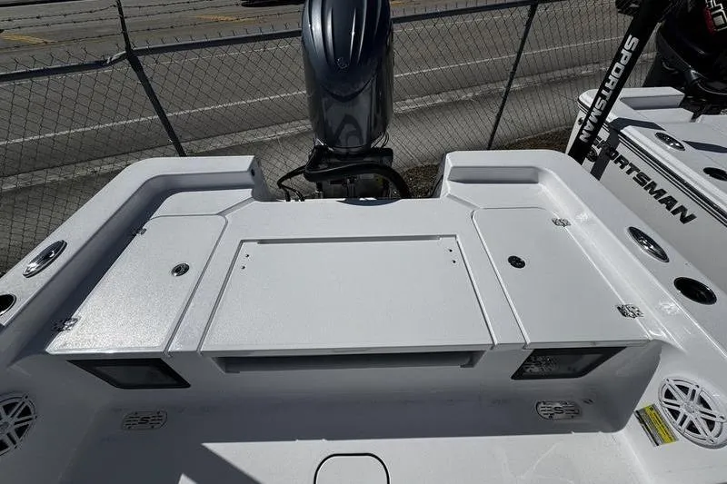 Slide: The Image of 2026 Sportsman Masters 227 Bay Boat deck with motor and storage compartments. - 14
