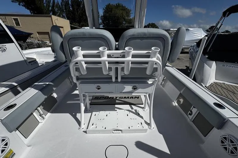 Slide: The Image of 2026 Sportsman Masters 227 Bay Boat interior with seating and rod holders. - 16