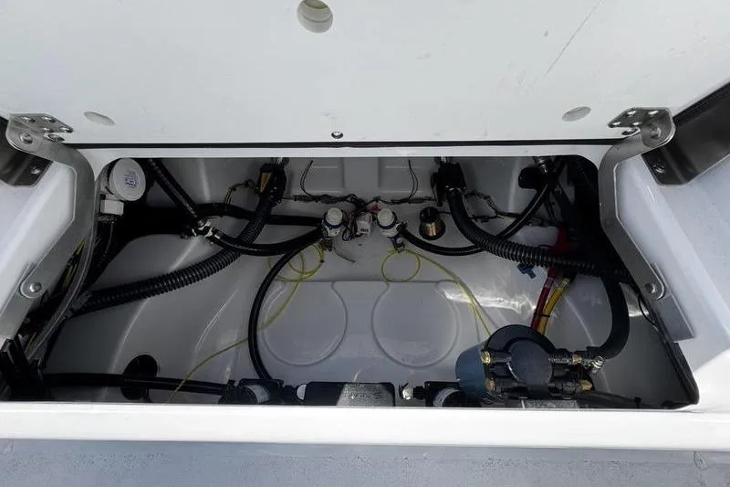 Slide: The Image of 2026 Sportsman Masters 227 Bay Boat wiring and plumbing compartment. - 18