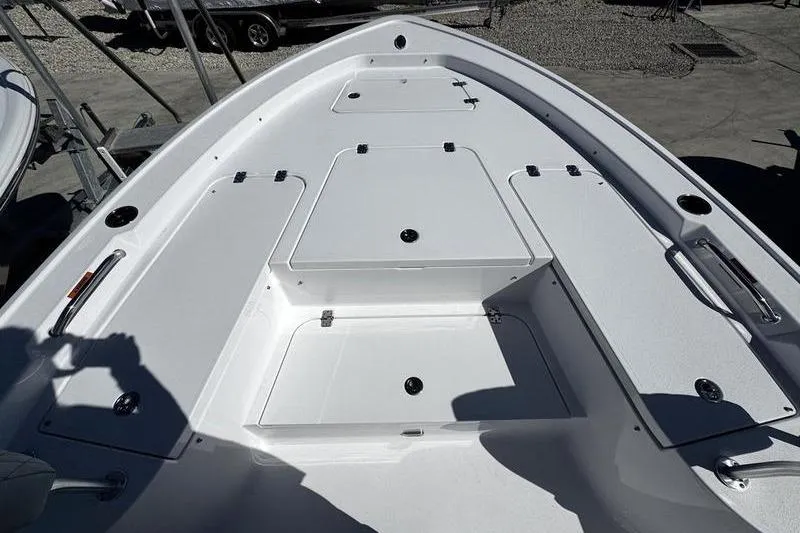 Slide: The Image of 2026 Sportsman Masters 227 Bay Boat deck with storage compartments and sleek design. - 3