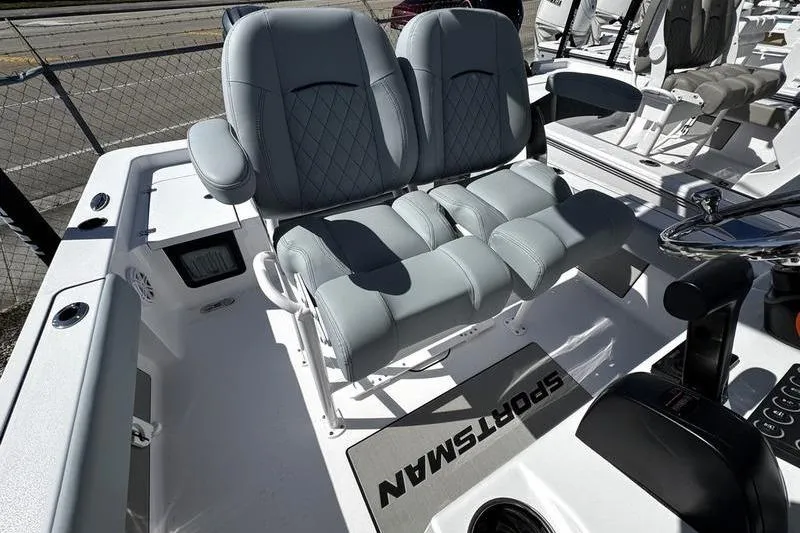 Slide: The Image of 2026 Sportsman Masters 227 Bay Boat with dual cushioned seats and modern console. - 8