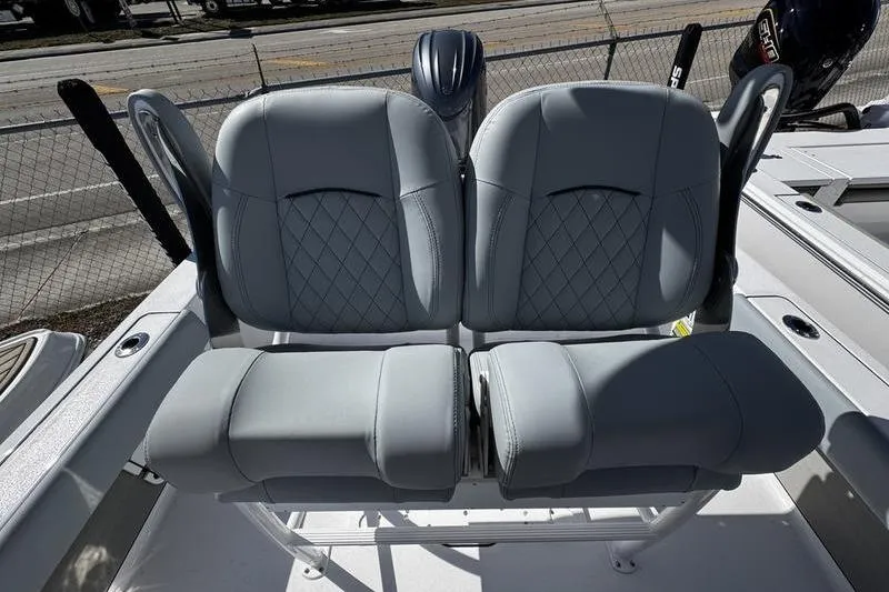 Slide: The Image of 2026 Sportsman Masters 227 Bay Boat with dual cushioned seats. - 9