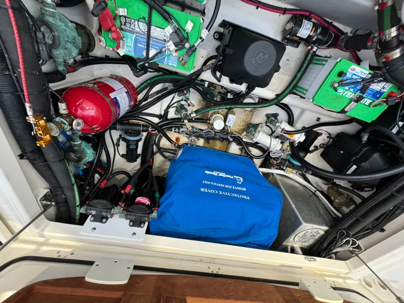 Slide: The Image of Engine compartment of a 2017 Boston Whaler 370 Outrage with wiring and components. - 12