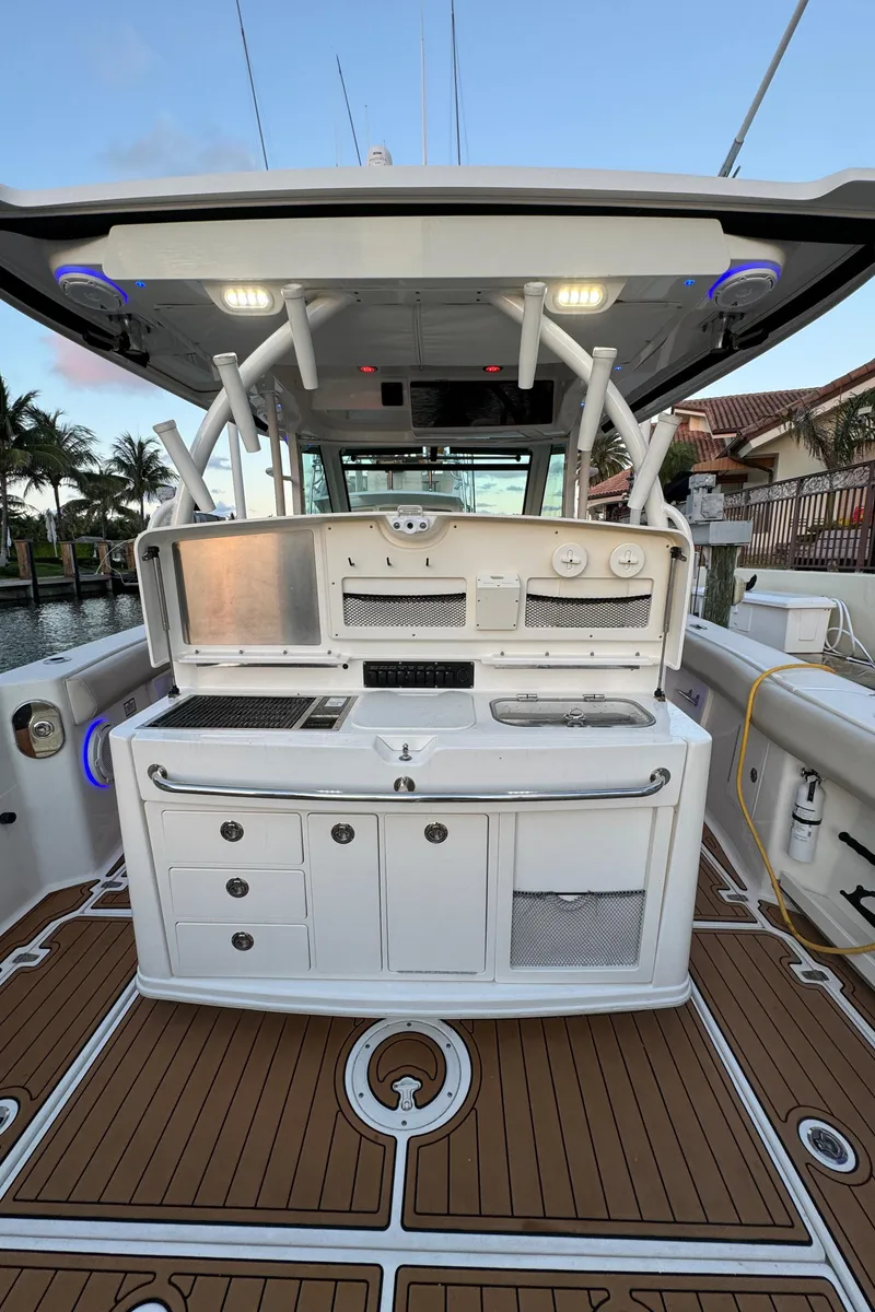 Slide: The Image of 2017 Boston Whaler 370 Outrage boat with sleek deck and modern amenities. - 18