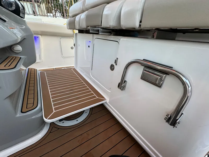 Slide: The Image of 2017 Boston Whaler 370 Outrage interior with teak flooring and seating area. - 22