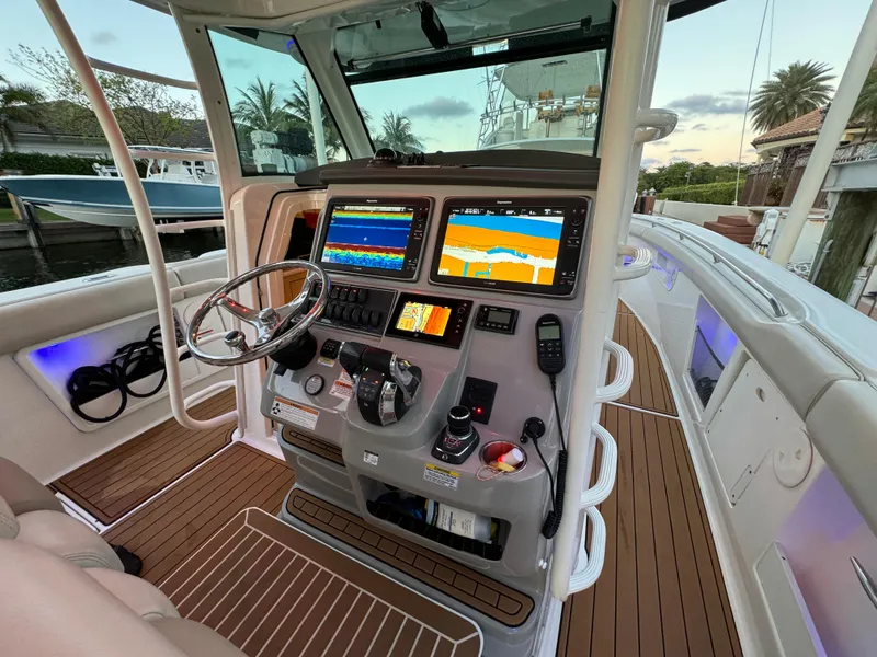 Slide: The Image of 2017 Boston Whaler 370 Outrage helm with advanced navigation displays and controls. - 25