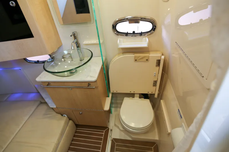 Slide: The Image of Luxurious 2017 Boston Whaler 370 Outrage cabin with modern bathroom amenities. - 29