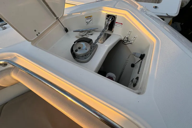 Slide: The Image of 2017 Boston Whaler 370 Outrage boat interior storage compartment with open hatch. - 45