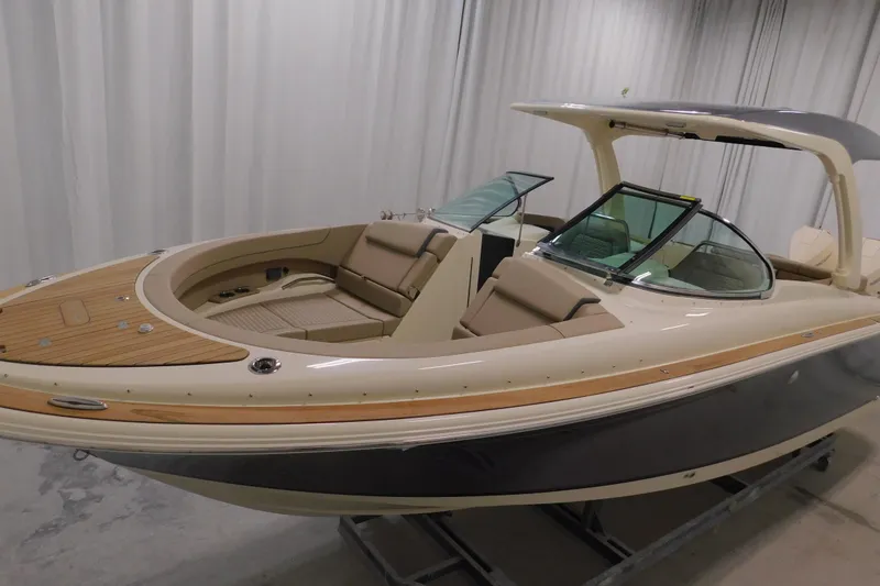 Slide: The Image of 2024 Chris-Craft Launch 31 GT boat with elegant design and luxurious seating. - 9