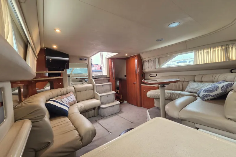 Slide: The Image of Luxurious interior of 2000 Sea Ray 420 Aft Cabin yacht with plush seating and modern amenities. - 17