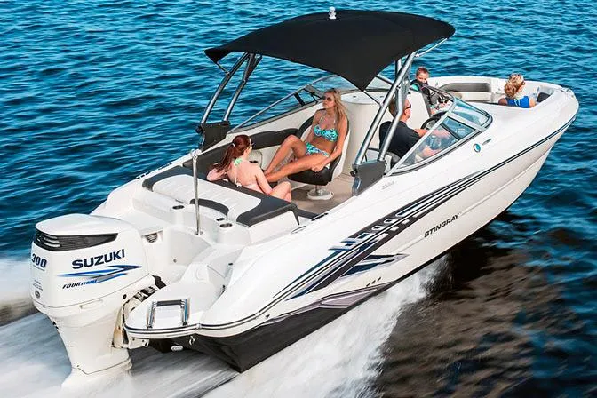 Slide: The Image of Manufacturer Provided Image: 2017 Stingray 234 LR boat cruising on water with passengers. - 6