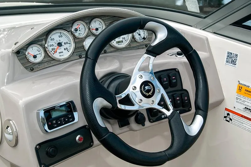 Slide: The Image of Manufacturer Provided Image: 2017 Stingray 234 LR boat dashboard with steering wheel and gauges. - 9