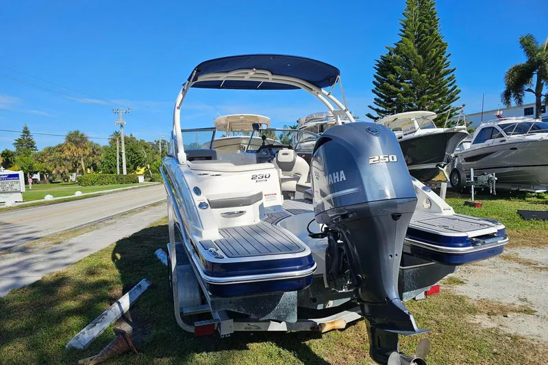 Slide: The Image of Chaparral 230 Suncoast 2008 boat with Yamaha 250 engine on trailer, sunny day. - 2