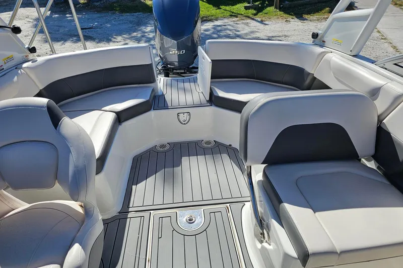 Slide: The Image of Interior of 2008 Chaparral 230 Suncoast boat with seating and outboard motor. - 8