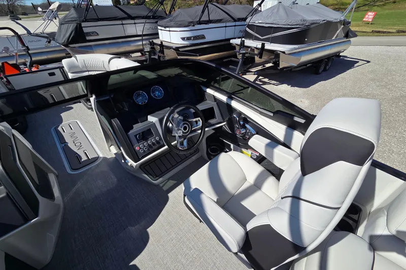 Slide: The Image of Interior of 2026 Avalon Platinum Catalina 2785 Elite Windshield boat, featuring modern dashboard and seating. - 10