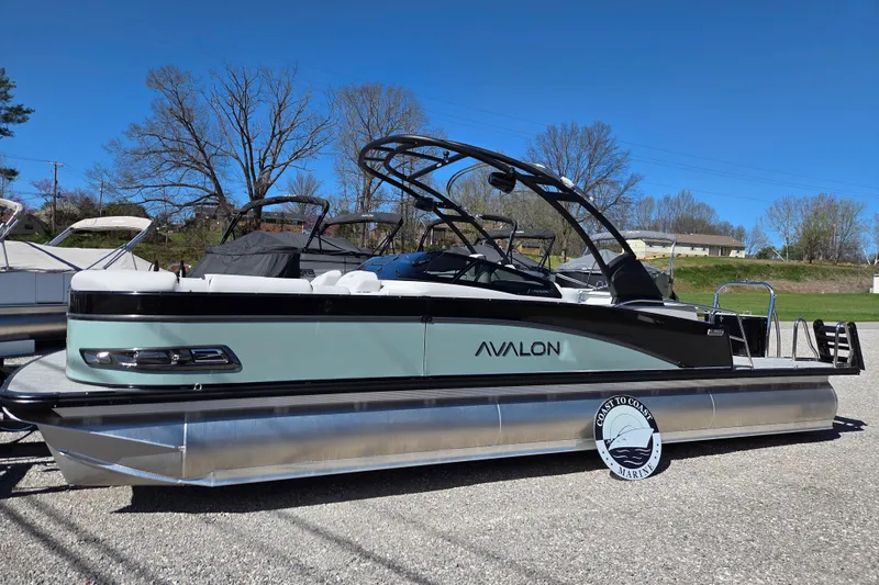 Slide: The Image of 2026 Avalon Platinum Catalina 2785 Elite Windshield pontoon boat on display outdoors. - 4