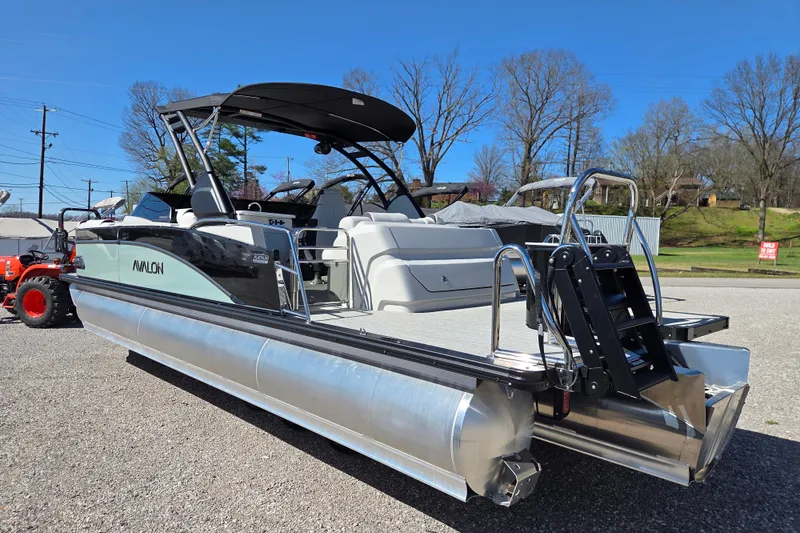 Slide: The Image of 2026 Avalon Platinum Catalina 2785 Elite Windshield pontoon boat on display outdoors. - 6