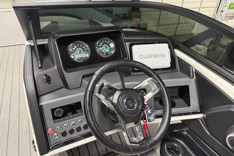 Slide: The Image of Steering console of 2026 Avalon Catalina Quad Lounger with Garmin display and gauges. - 10