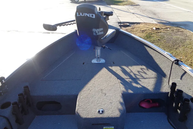 Slide: The Image of 2021 Lund 1775 Pro Guide boat interior with seating and storage compartments. - 12