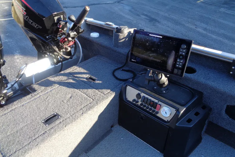 Slide: The Image of 2021 Lund 1775 Pro Guide boat interior with motor and control panel. - 15