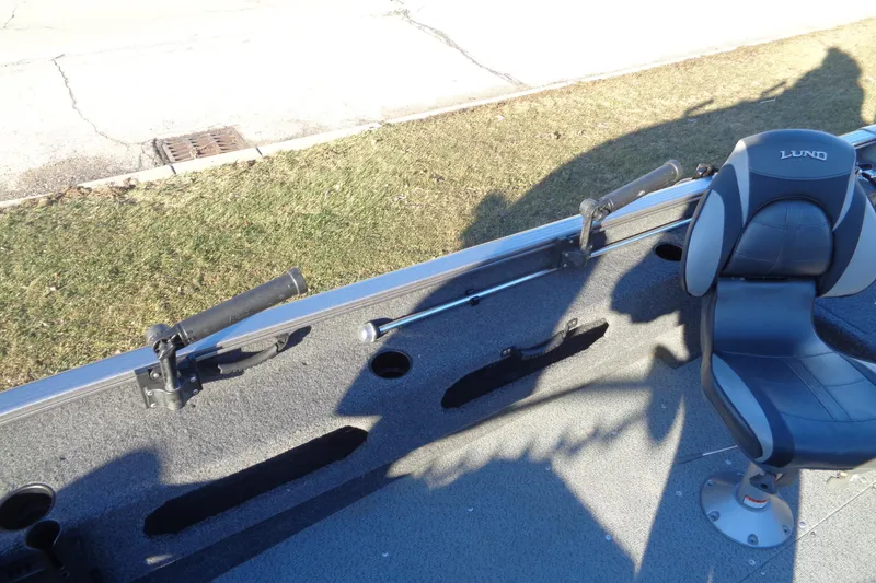 Slide: The Image of 2021 Lund 1775 Pro Guide boat interior with seating and rod holders. - 16