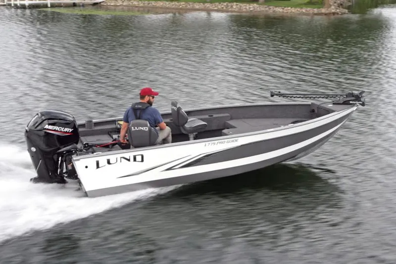 Slide: The Image of Manufacturer Provided Image: 2021 Lund 1775 Pro Guide boat cruising on a lake. - 18