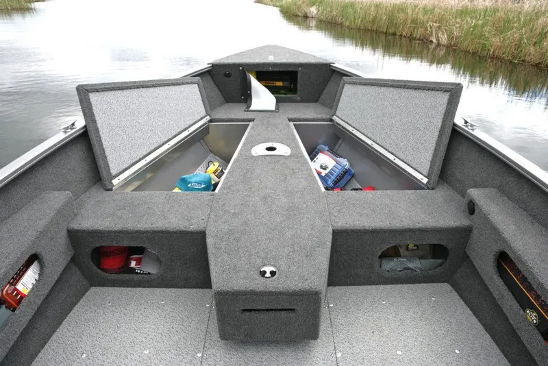 Slide: The Image of Manufacturer Provided Image: 2021 Lund 1775 Pro Guide boat with open storage compartments on a calm waterway. - 21