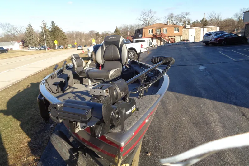 Slide: The Image of 2021 Lund 1775 Pro Guide boat parked on a sunny street. - 8