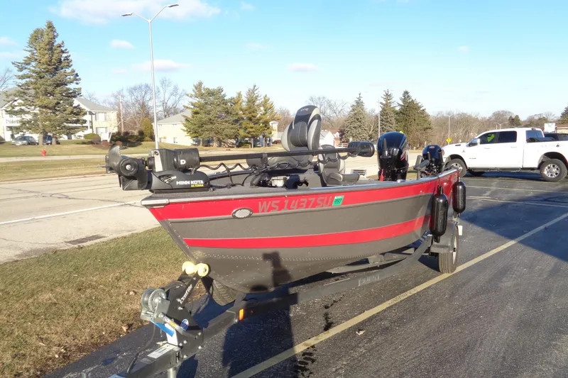 Slide: The Image of 2021 Lund 1775 Pro Guide boat on trailer, parked outdoors on a sunny day. - 9